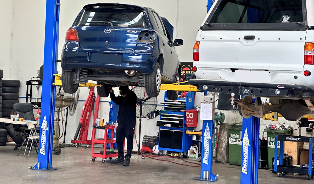 Car's on hoist undergoing Log Book Servicing